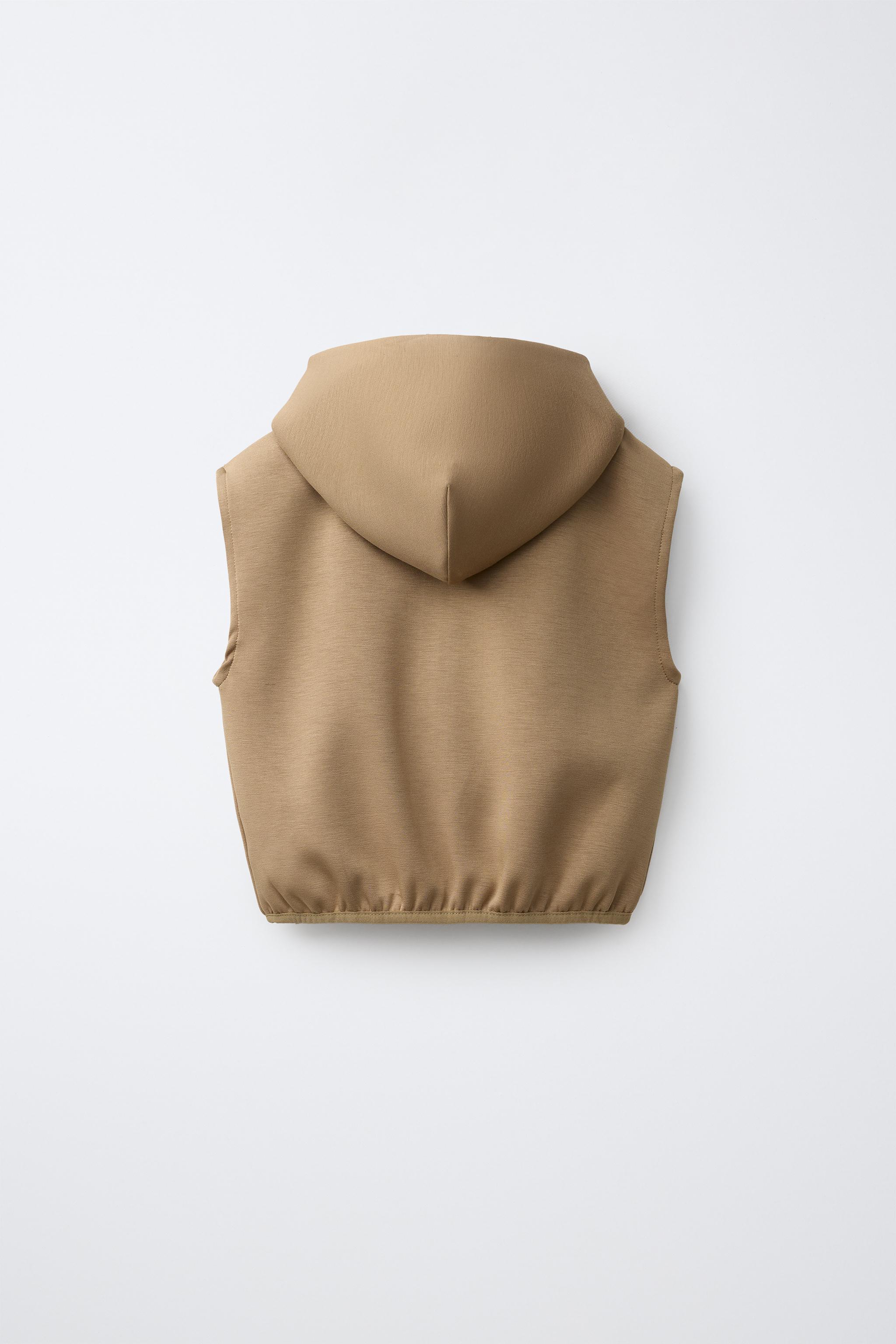 GILET À CAPUCHE EN INTERLOCK